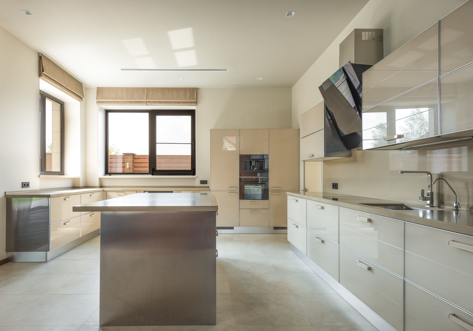 Bright and spacious modern kitchen interior featuring sleek cabinets and a central kitchen island in Yakima, WA